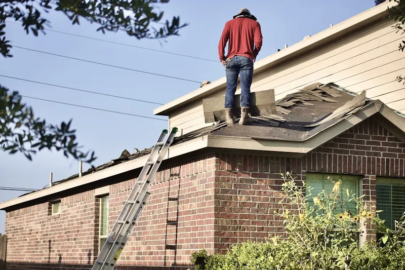 Professional roofer working on a residential roof in Valley Forge
